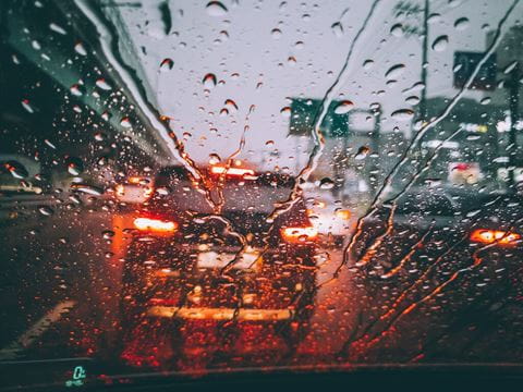Medium-rain-drops-on-vehicle-windshield-1765286