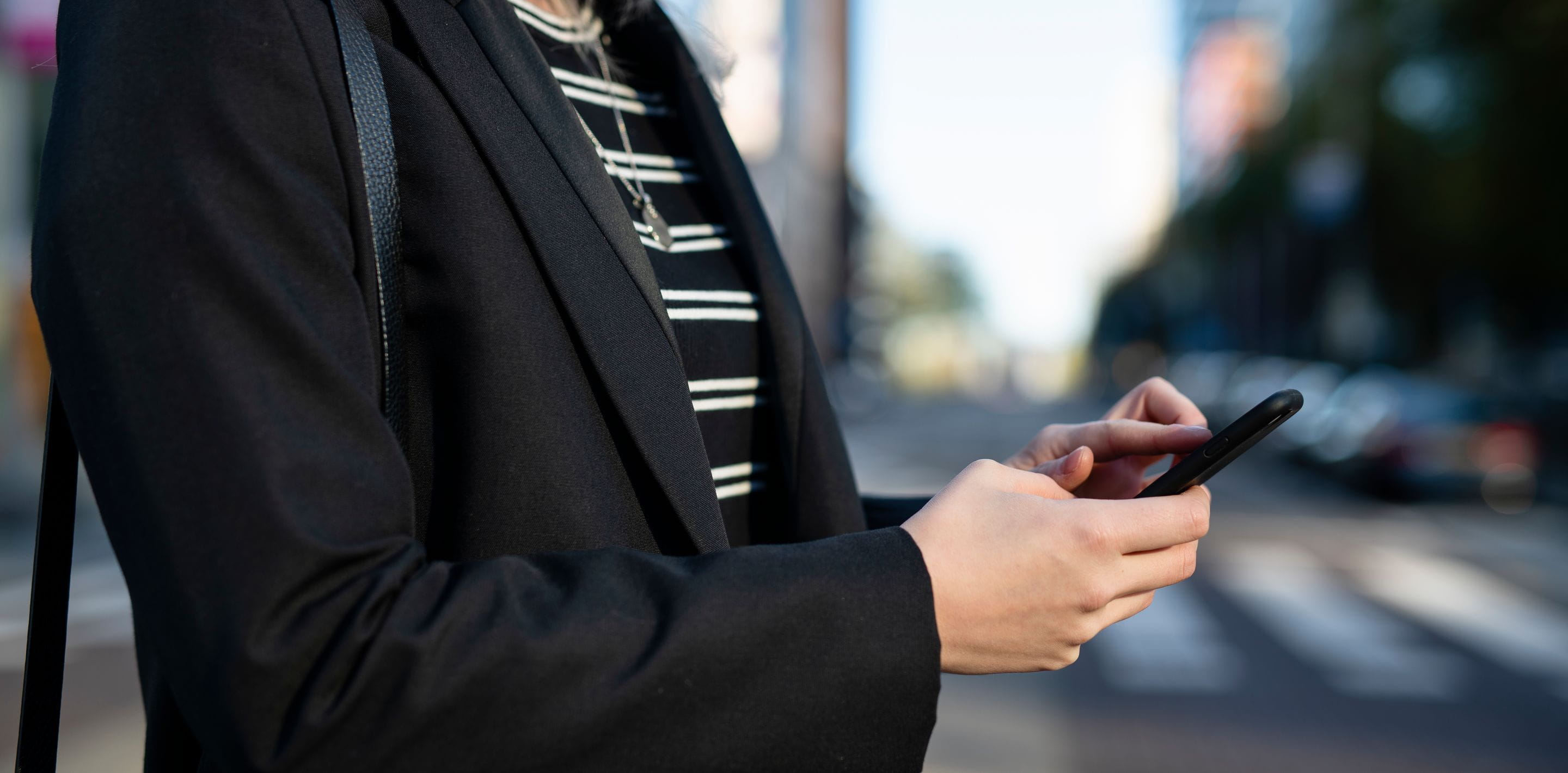 female hands holdling a mobile phone